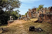 Angkor - Eastern Mebon - towered passageways leading to the first enclosure of the temple,  with stone lions guarding the entrance.